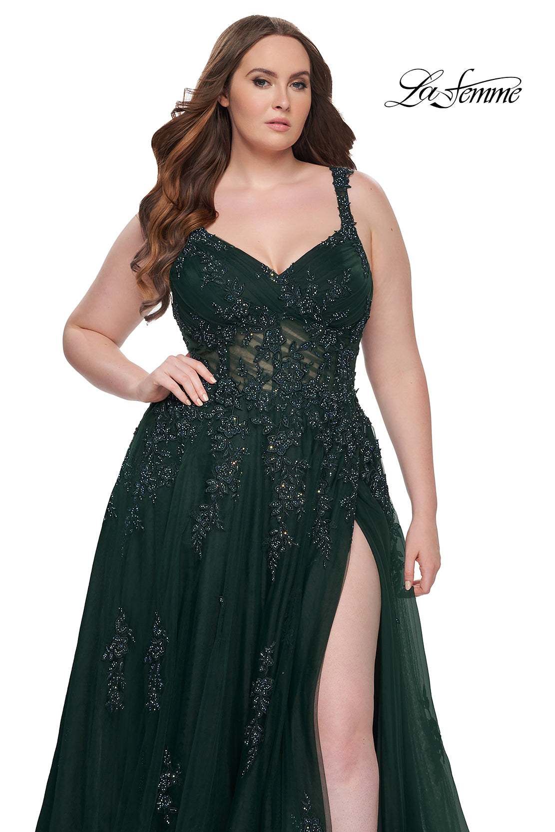 Shop La Femme 31383 Beautiful plus size gown with lace applique and ruching along the bodice. A-line tulle dress with high slit and illusion back. Back zipper closure. B Chic Fashions Shop La Femme 31383 Beautiful plus size gown with lace applique and ruching along the bodice. A-line tulle dress with high slit and illusion back. Back zipper closure. B Chic Fashions