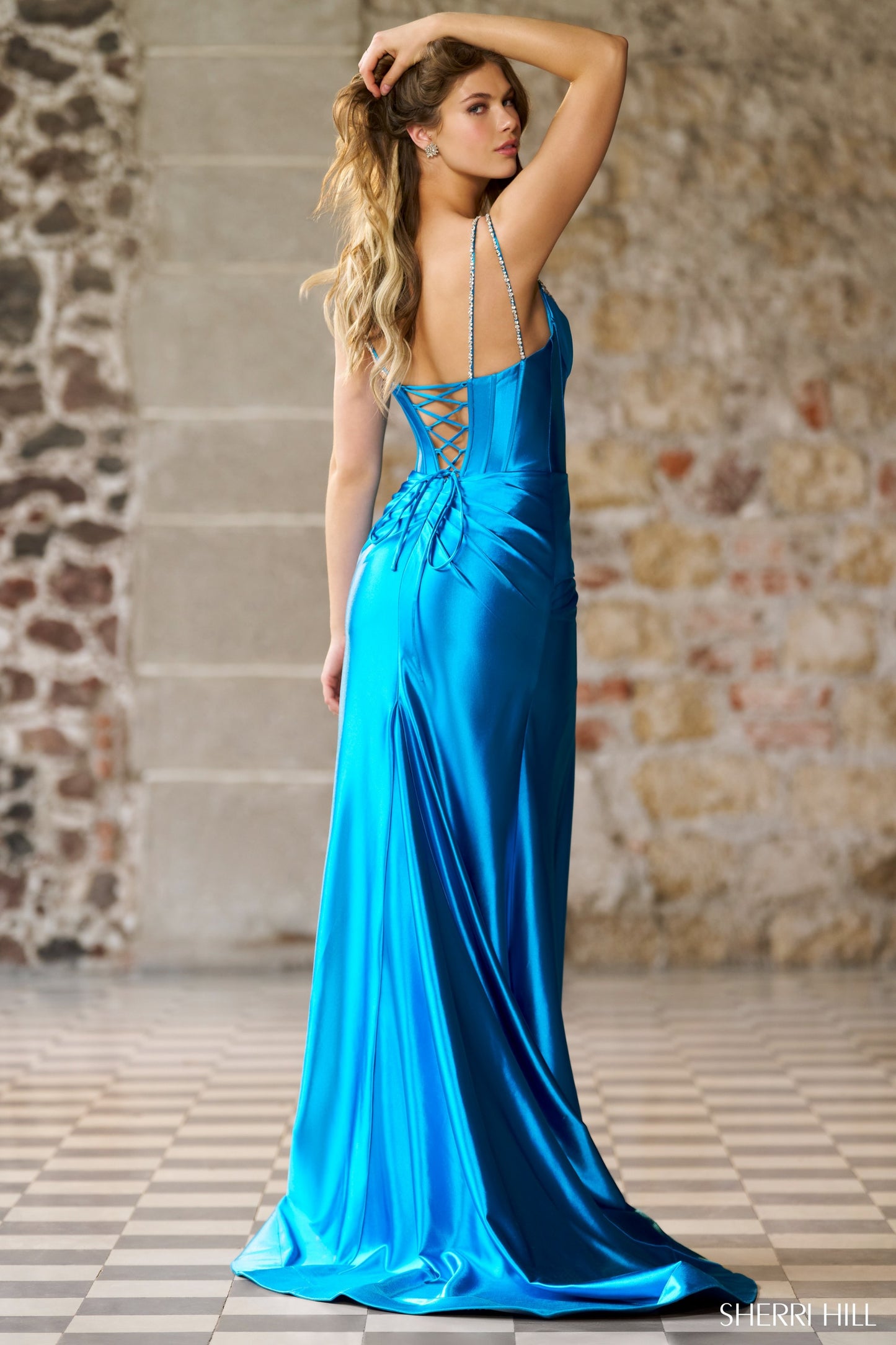 Sherri Hill 56430 Fitted Silky Stretched Satin Gown with Rhinestone Embellished Deep V Neckline, and a Ruched Skirt with Slit