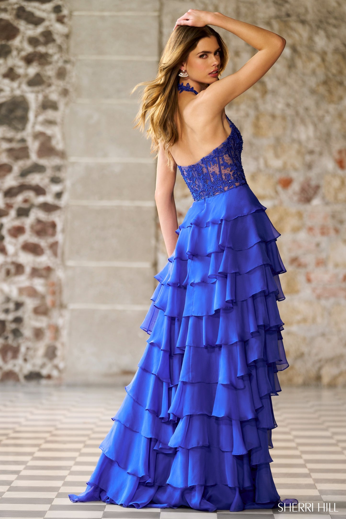 Sherri Hill 56656 Halter Gown with Leaf Lace Corset Bodice and a Ruffle Chiffon Skirt with Slit