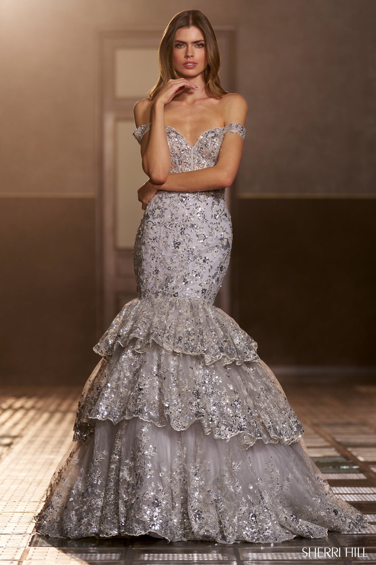 Sherri Hill 56687 Sequin Lace Mermaid Gown with Corset Bodice, Off the Shoulder Straps, and Ruffle Skirt