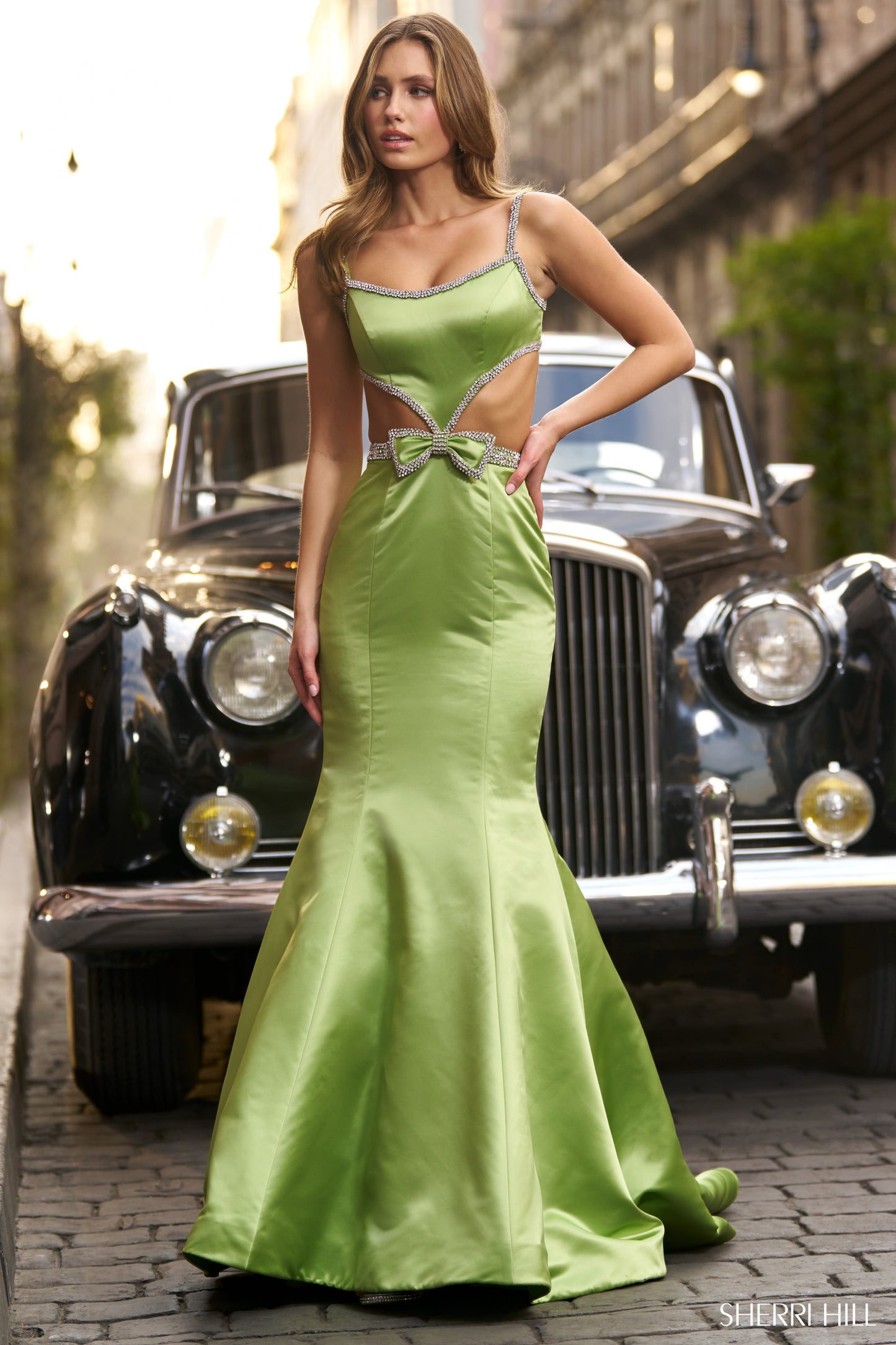 Sherri Hill 56699 Satin Mermaid Gown with Cut Outs, Bow and Bead Embellishments, and an Open Back