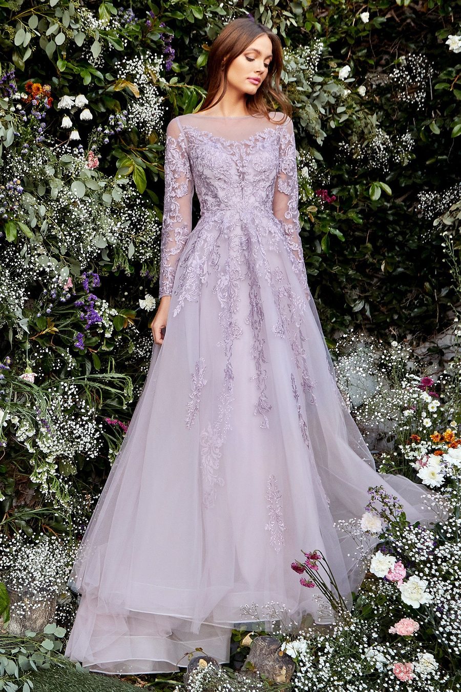 Andrea and Leo A1024 Long sleeve dress with illusion sweetheart neckline, long sheer sleeves and open back. Luxurious violet embroidery glitters with embedded crystals and beautifully frames the bodice, embellish the long sleeves, and continues down the A-line skirt. 